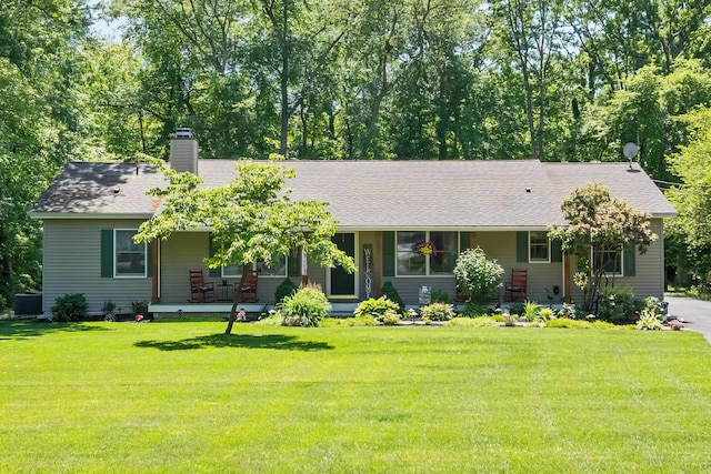 1431 Burleigh Rd, Green Creek, NJ 08210 - view of front of home with covered porch, a front lawn, a chimney, and roof with shingles