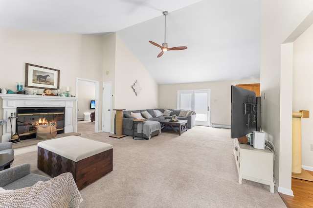 1431 Burleigh Rd, Green Creek, NJ 08210 - living room featuring high vaulted ceiling, a ceiling fan, a glass covered fireplace, light carpet, and baseboards