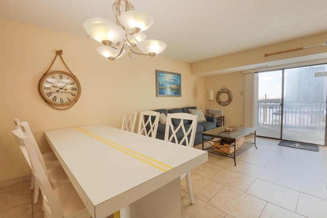 dining room featuring light tile patterned floors and a notable chandelier