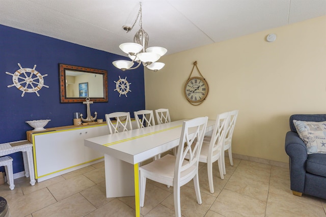 tiled dining area featuring an inviting chandelier