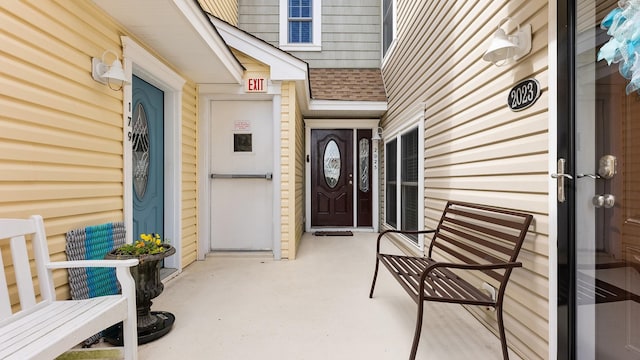 2025 Dune Dr Unit 2025, Avalon, NJ 08202 - view of exterior entry featuring roof with shingles