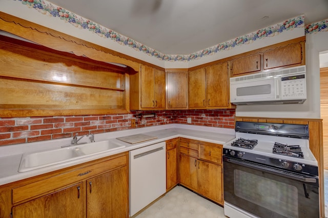 kitchen with sink and white appliances