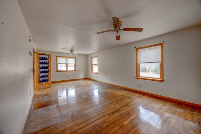 spare room featuring ceiling fan and light hardwood / wood-style floors