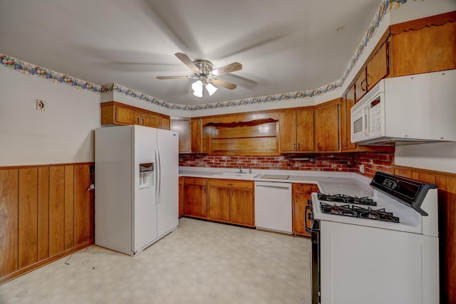 kitchen featuring sink, white appliances, and ceiling fan