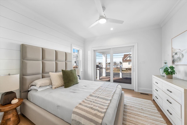 bedroom featuring ceiling fan, crown molding, access to exterior, and light hardwood / wood-style floors