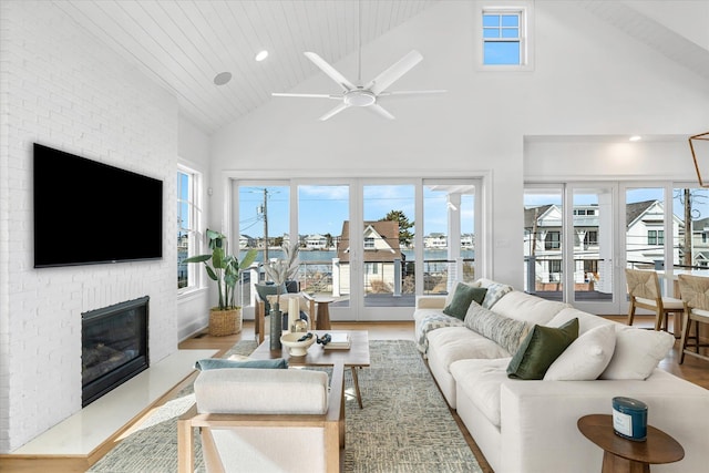 274 106th St, Stone Harbor, NJ 08247 - living area featuring high vaulted ceiling, ceiling fan, a fireplace, wood finished floors, and wood ceiling