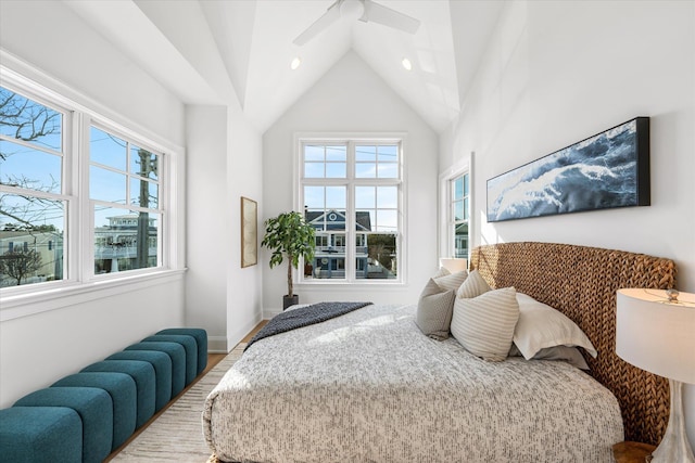 bedroom with high vaulted ceiling