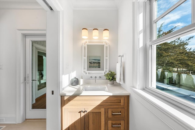 274 106th St, Stone Harbor, NJ 08247 - bathroom featuring crown molding, healthy amount of natural light, vanity, and tile patterned flooring