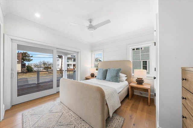 bedroom featuring ornamental molding, access to outside, ceiling fan, and light hardwood / wood-style flooring