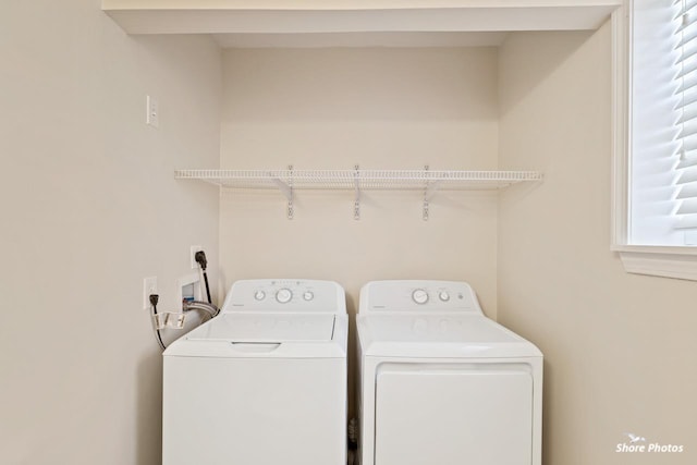 washroom featuring washer and dryer