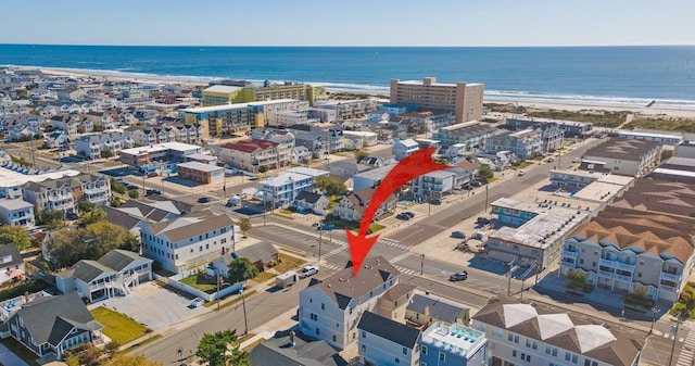 bird's eye view featuring a water view and a view of the beach