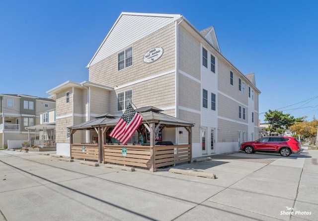 townhome / multi-family property with a gazebo