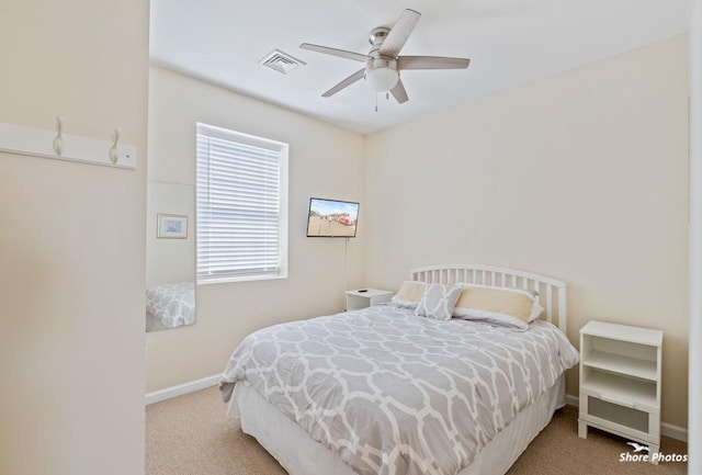 carpeted bedroom with ceiling fan