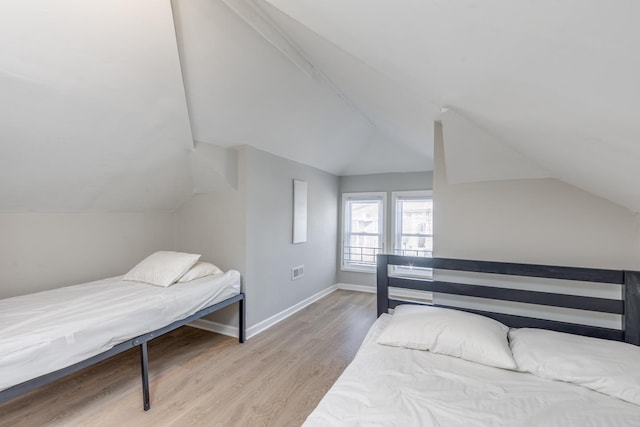 222 E Burk Ave Unit 4, Wildwood, NJ 08260 - bedroom featuring light wood-type flooring, lofted ceiling, and baseboards