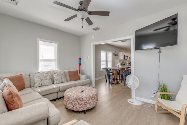 222 E Burk Ave Unit 4, Wildwood, NJ 08260 - living room with light wood finished floors, a ceiling fan, and baseboards