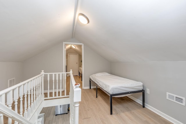 222 E Burk Ave Unit 4, Wildwood, NJ 08260 - bedroom with wood finished floors, vaulted ceiling, and baseboards