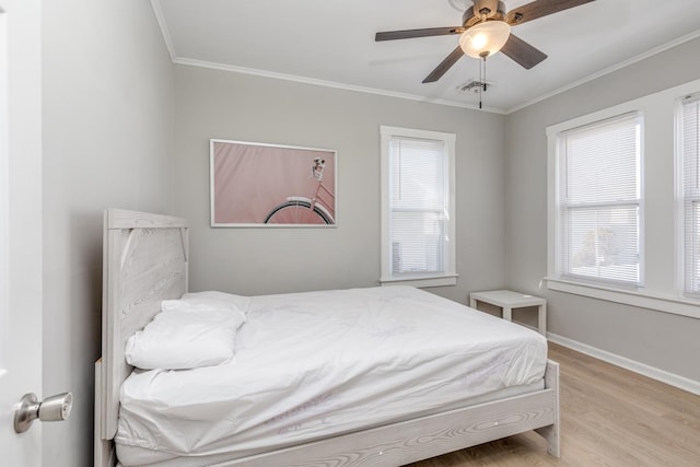 222 E Burk Ave Unit 4, Wildwood, NJ 08260 - bedroom with light wood-style flooring, crown molding, baseboards, and ceiling fan