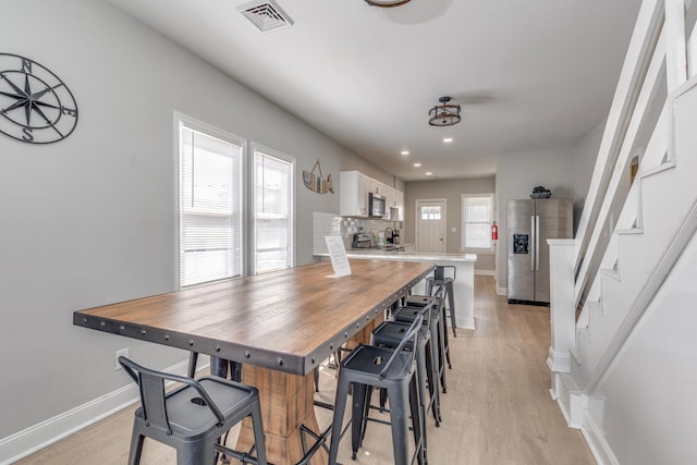 222 E Burk Ave Unit 4, Wildwood, NJ 08260 - kitchen with appliances with stainless steel finishes, white cabinetry, light wood finished floors, baseboards, and recessed lighting