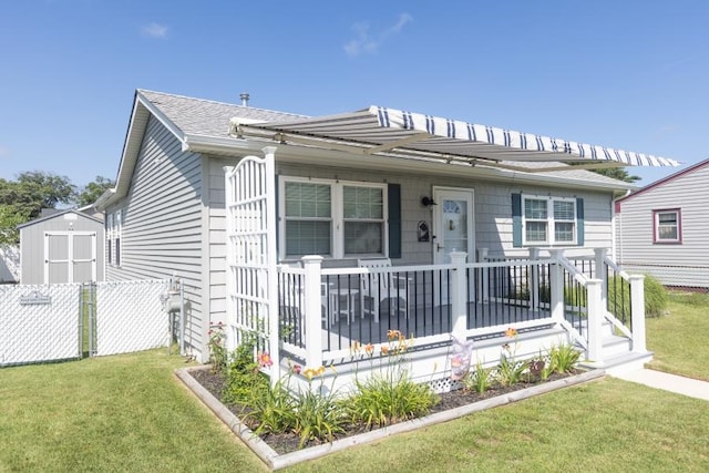 213 Hollywood Ave, Villas, NJ 08251 - view of front of house featuring a storage unit and roof with shingles