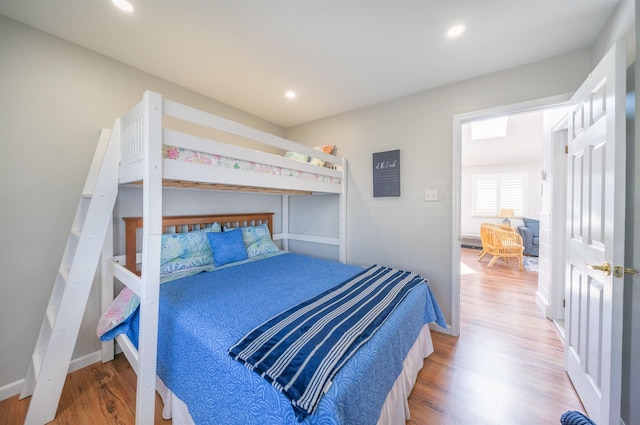 bedroom featuring recessed lighting and wood finished floors