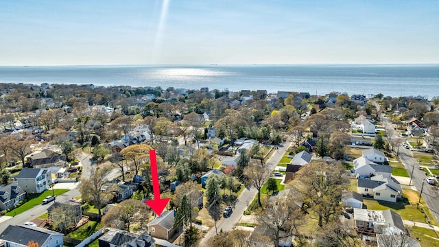 drone / aerial view with a water view and a residential view