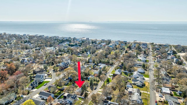 birds eye view of property with a residential view and a water view