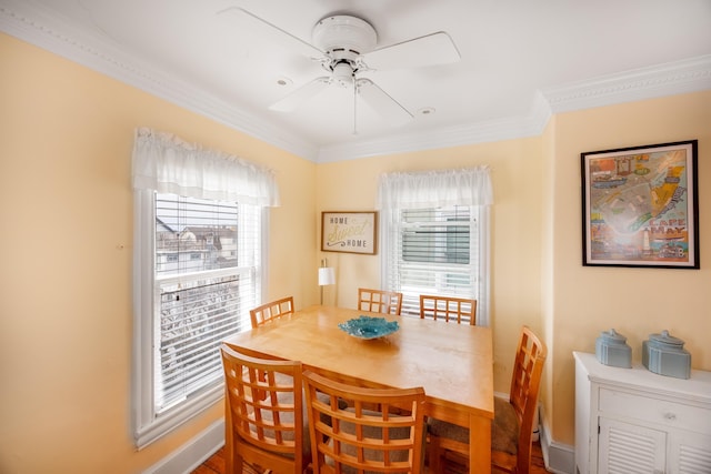 dining room featuring ornamental molding and ceiling fan