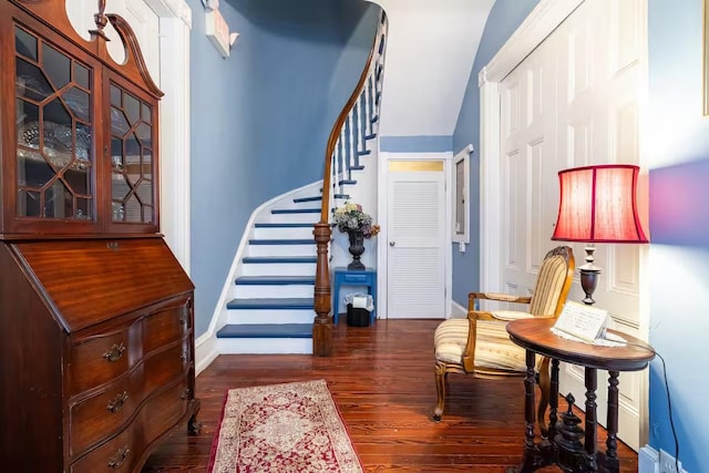 foyer entrance with dark hardwood / wood-style floors