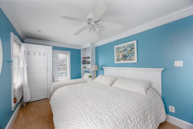 bedroom featuring crown molding, light colored carpet, and ceiling fan