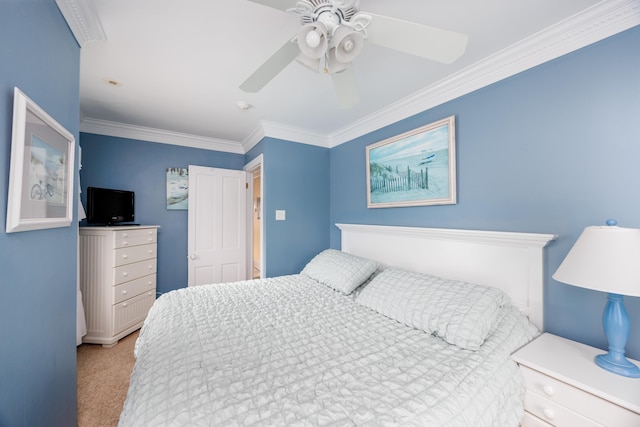 carpeted bedroom featuring crown molding and ceiling fan