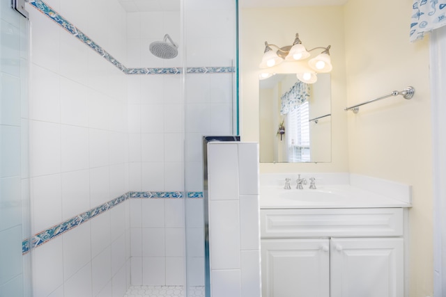 bathroom featuring vanity and a tile shower