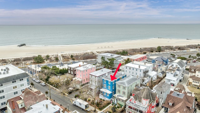 aerial view featuring a water view and a beach view