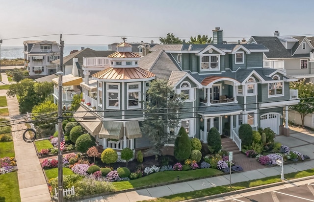 2404 Atlantic Ave, Longport, NJ 08403 - townhome / multi-family property featuring a balcony, a standing seam roof, a metal roof, and a chimney