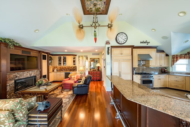 2404 Atlantic Ave, Longport, NJ 08403 - living area with wine cooler, a high end fireplace, a chandelier, wood finished floors, and high vaulted ceiling