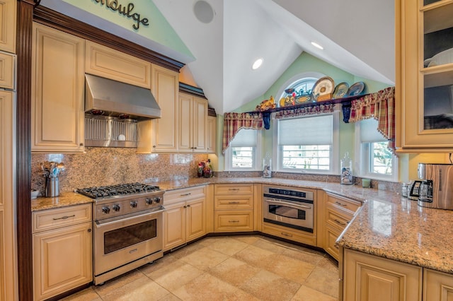 2404 Atlantic Ave, Longport, NJ 08403 - kitchen featuring appliances with stainless steel finishes, ventilation hood, lofted ceiling, decorative backsplash, and light stone countertops