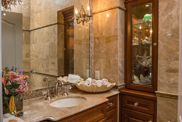 2404 Atlantic Ave, Longport, NJ 08403 - bathroom featuring tile walls, vanity, a chandelier, and tasteful backsplash