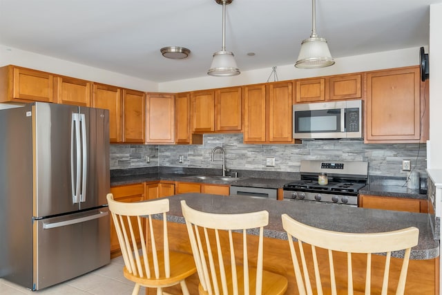 227 E Leaming Ave Unit A, Wildwood, NJ 08260 - kitchen featuring stainless steel appliances, a sink, dark countertops, and tasteful backsplash