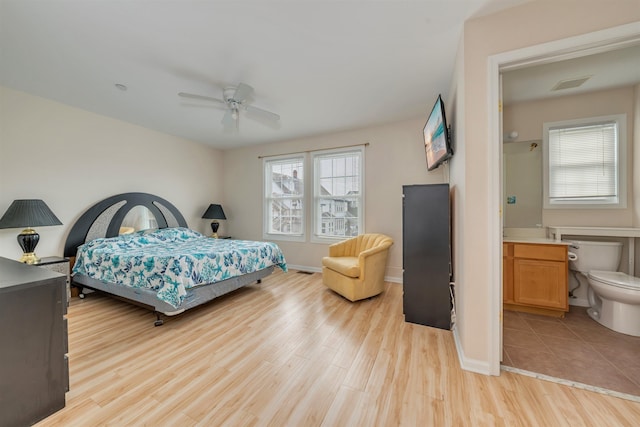 227 E Leaming Ave Unit A, Wildwood, NJ 08260 - bedroom with multiple windows, light wood-type flooring, baseboards, and ceiling fan