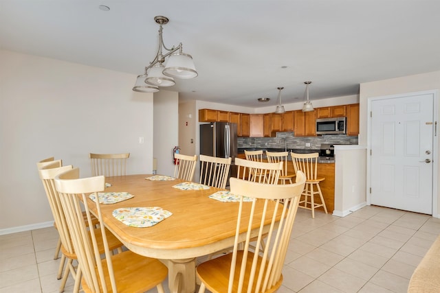 227 E Leaming Ave Unit A, Wildwood, NJ 08260 - dining space featuring light tile patterned floors and baseboards