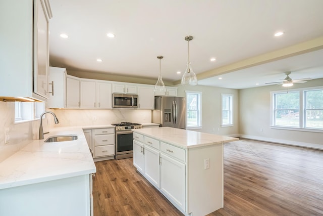 70 W Rising Sun Dr, Ocean View, NJ 08230 - kitchen featuring stainless steel appliances, white cabinets, recessed lighting, light wood finished floors, and tasteful backsplash