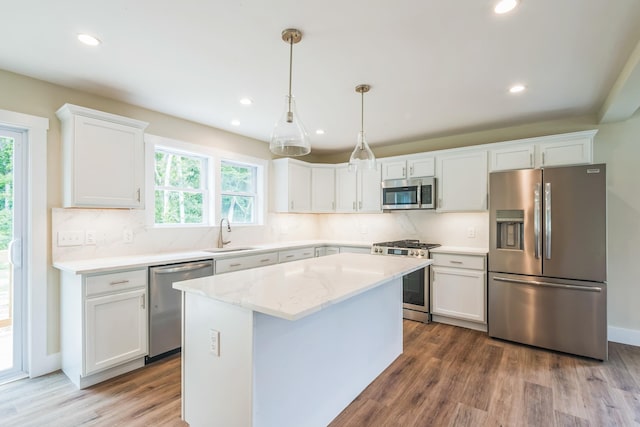 70 W Rising Sun Dr, Ocean View, NJ 08230 - kitchen with appliances with stainless steel finishes, white cabinets, wood finished floors, recessed lighting, and decorative backsplash