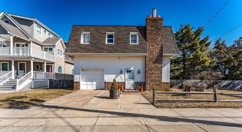 view of front of house featuring a garage, fence, driveway, roof with shingles, and a chimney