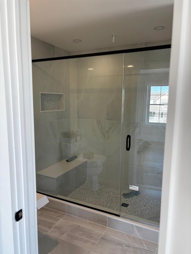 bathroom featuring an enclosed shower