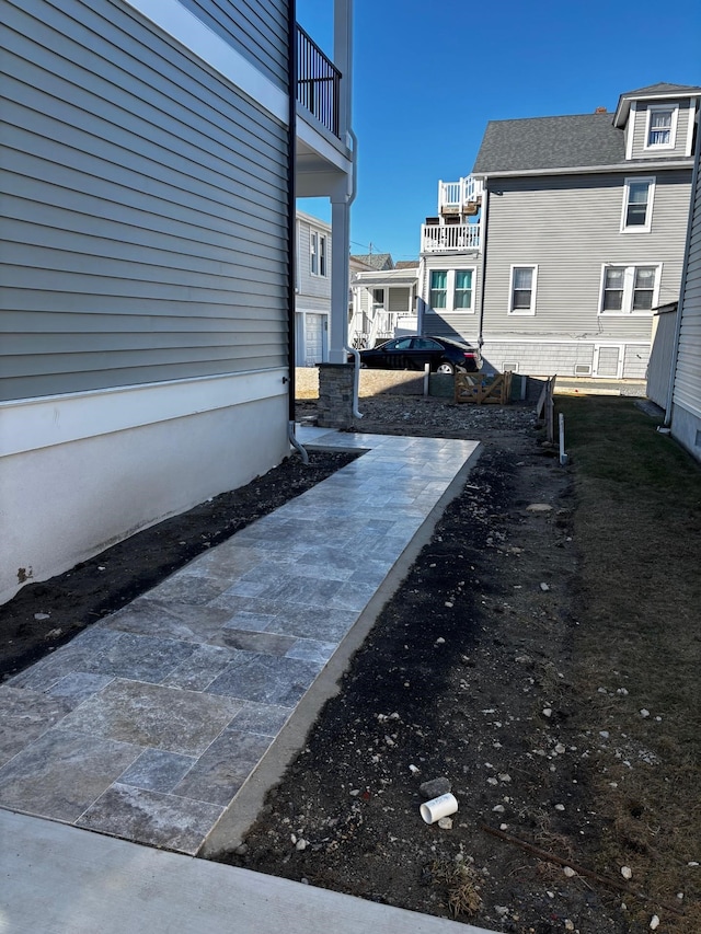 view of yard featuring a balcony