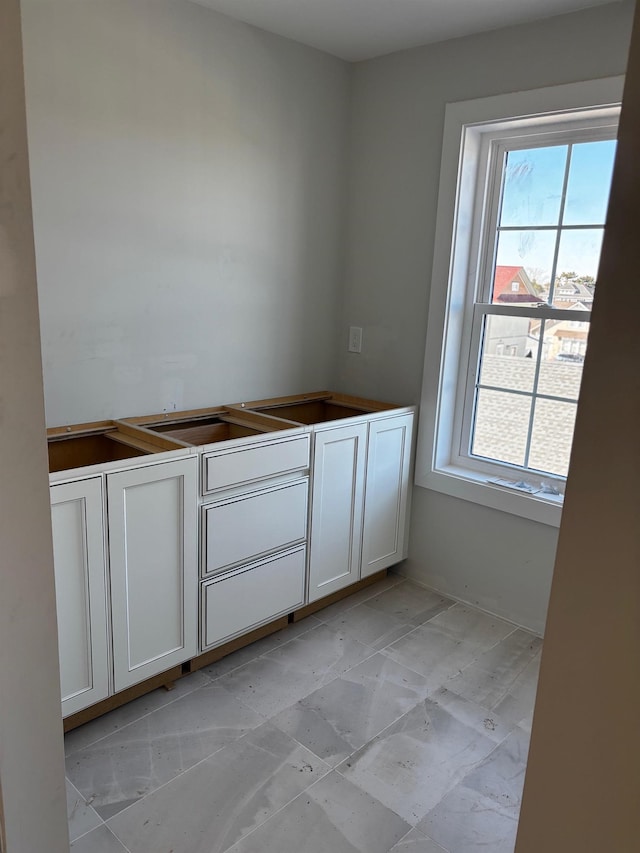 interior space with white cabinetry