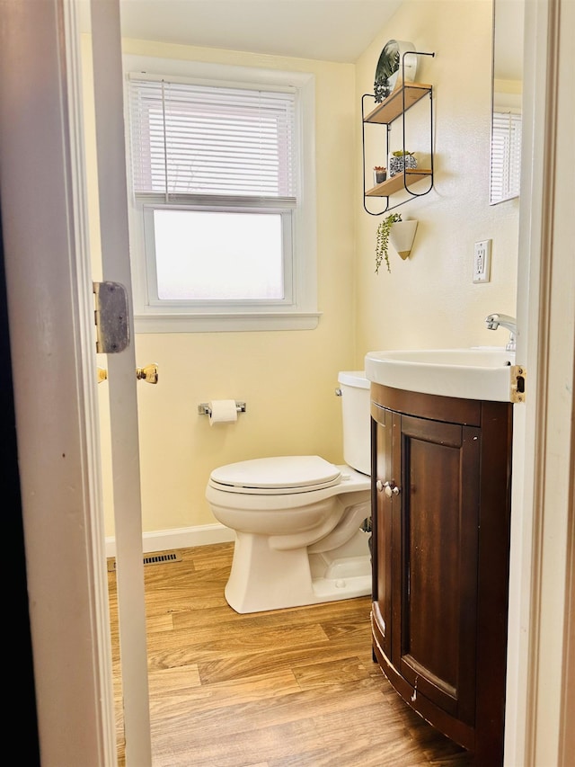 203 E Vermont Ave, Rio Grande, NJ 08242 - half bath with toilet, vanity, baseboards, and wood finished floors