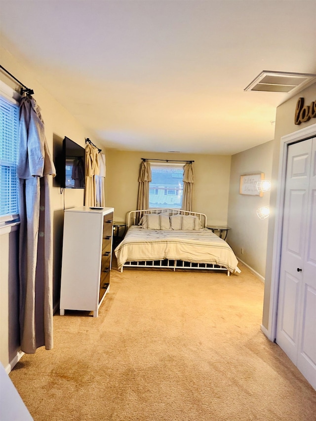 203 E Vermont Ave, Rio Grande, NJ 08242 - bedroom featuring baseboards, light carpet, a closet, and visible vents