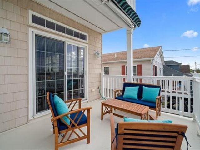 balcony with an outdoor hangout area