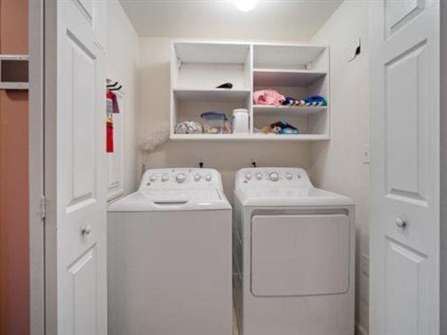 laundry room with washer and dryer