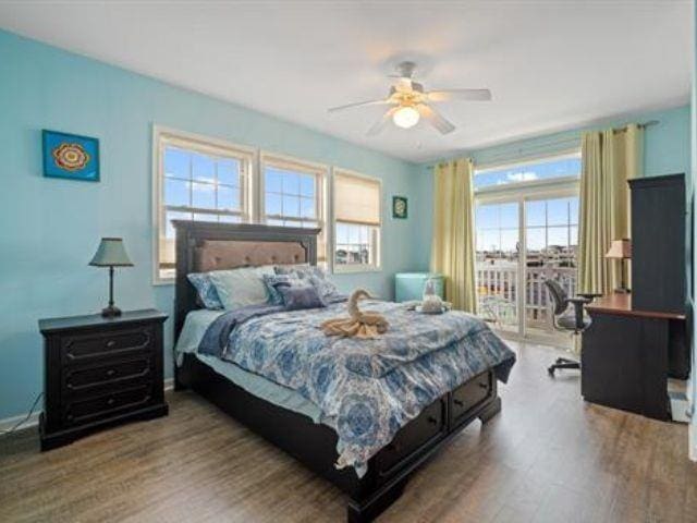 bedroom featuring ceiling fan and hardwood / wood-style floors